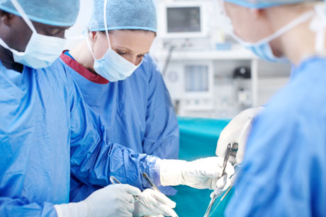 medical team performs surgery